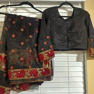 Indian/ Pakistani Embroidered Black and Red net saree.